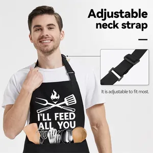 Detail view of black canvas kitchen apron featuring adjustable neck strap and front pocket design.
