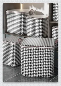 Detailed view of elegant houndstooth pattern storage bags in a organized closet