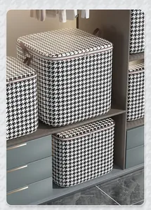 Large capacity houndstooth pattern storage bags organized neatly inside a modern closet