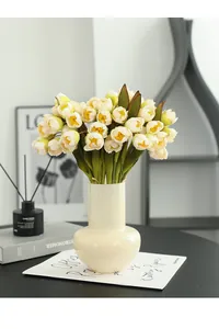 Artificial silk flower bouquet detail shot, elegant home decor flower arrangement in vase.