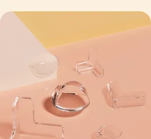 Detail view of various transparent soft furniture corner protectors for child safety