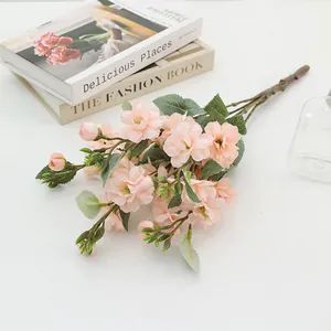 Artificial pink wild rose bouquet detail, floral arrangement for home decor, wedding ornament.