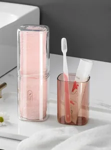 Portable travel toothbrush holder set including storage cup and pink towel for bathroom