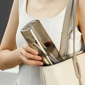 Portable 3-in-1 travel toothbrush and toothpaste storage cup set in translucent brown