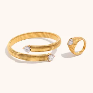 Detailed view of gold-plated ribbed stainless steel heart zirconia jewelry set.