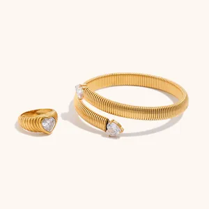 Close-up detail of 18K gold plated ribbed jewelry set with heart-shaped zircon stones