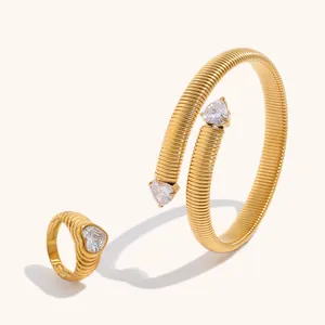 Detail view of 18K gold plated ribbed stainless steel heart zircon ring and bracelet set