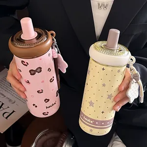 Insulated stainless steel straw water bottles with cute patterns in pink and yellow