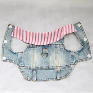 Detail view of distressed denim dog vest with striped collar and harness D-ring.