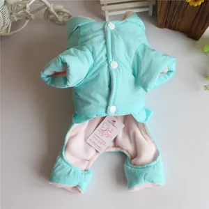 Detail view of the warm fleece lining and button closure on the turquoise dog winter jumpsuit.