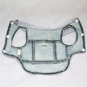 Detailed flat lay of light blue distressed denim pet vest with striped collar for small dogs