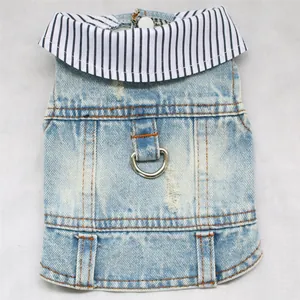 Detail view of denim dog vest featuring a leash ring and striped collar