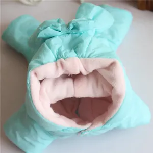 Detailed view of soft pink fleece lining on a mint green winter padded pet jumpsuit