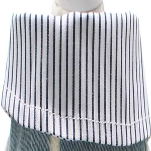 Macro detail showing the striped collar and denim fabric texture of a dog shirt vest
