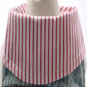 Close-up detail of the red and white striped collar on distressed denim dog shirt