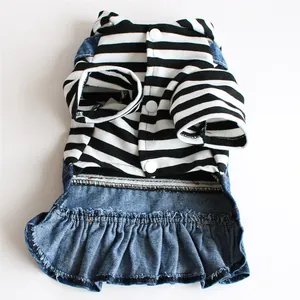 Detail of pet dress featuring black and white horizontal stripes and a ruffled denim skirt