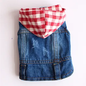 Detailed view of a pet denim vest featuring a red checkered hood and distressed finish