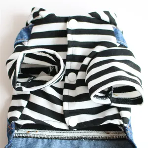 Detail of dog dress featuring black and white stripes and blue denim fabric