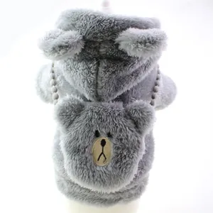 Close-up detail of grey fuzzy pet hoodie featuring cute bear embroidery and hood ears.