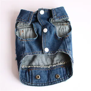 Detailed view of a stylish blue denim pet vest with white snap buttons and frayed hem.