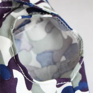 Detailed close-up of high-quality stitching on camouflage pet dog vest armhole section