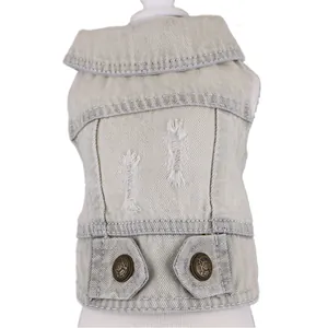 Close-up of a light-colored distressed denim pet vest for small dogs with metal buttons.