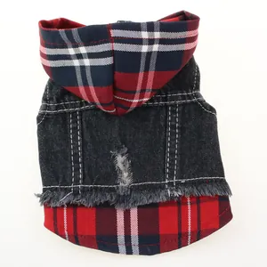 Close-up detail of a hooded pet vest featuring plaid patterns and denim fabric