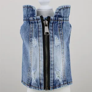 Close-up of pet denim vest featuring a metal zipper and stylish distressed ripped details.