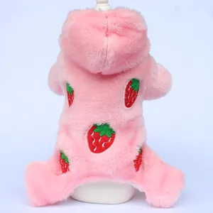 Detailed view of a pink plush pet jumpsuit featuring cute strawberry embroidery patterns.