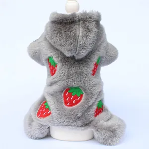 Detailed view of the strawberry embroidery on a grey furry dog hoodie for winter.