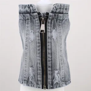 Detailed macro view of washed grey denim pet vest with front zipper and ripped holes