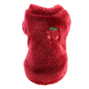 Detail view of a soft red plush pet vest featuring a cute embroidered cherry on the back