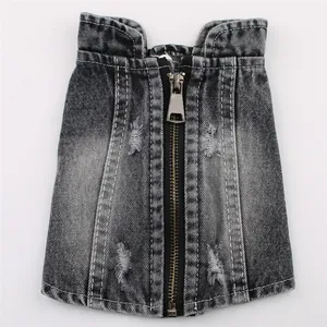Detailed macro view of distressed black denim pet vest with functional zipper closure