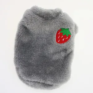 Close-up of soft gray plush pet sweater with strawberry embroidery detail