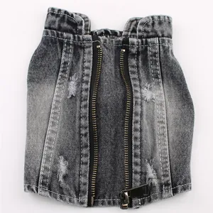 Detailed view of distressed black denim pet vest with double zippers and ripped fabric.