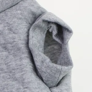 Detailed view of the armhole and durable internal stitching on gray pet clothing