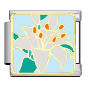 Detailed macro view of enamel lily floral Italian modular charm in gold plated steel