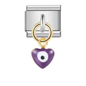 Close-up of stainless steel modular bracelet link with purple heart evil eye charm