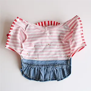 Detail view of pet striped denim dress showing interior lining and snap buttons.