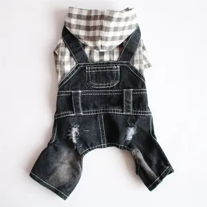 Detailed view showing the plaid hoodie fabric and black distressed denim overalls