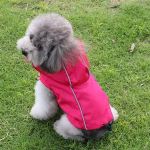 Detailed shot of pink waterproof pet jacket with reflective strips and drawstring