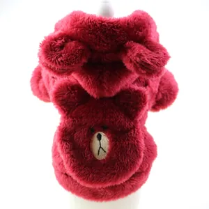 Close-up detail of a soft red plush dog hoodie featuring a cute bear face embroidery