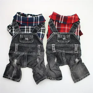 Macro view of two stylish pet denim plaid overalls in red and blue color variants
