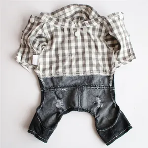 Interior detail of plaid pet jumpsuit featuring snap buttons and XS size tag