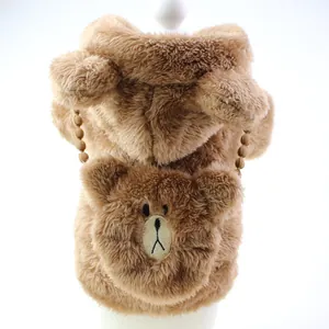 Close-up of brown plush pet dog hoodie with cute embroidered bear face pocket detail