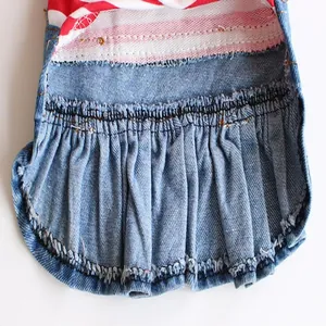 Macro detailed view of the ruffled blue denim hem on this striped pet dog dress skirt