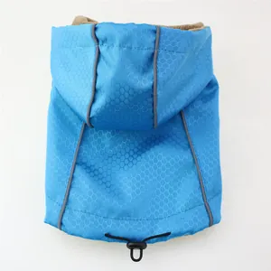 Close-up of waterproof honeycomb fabric and warm fleece lining on pet winter jacket