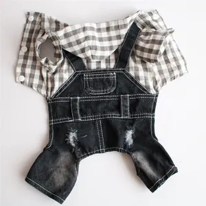 Flat lay view of a plaid shirt and denim overalls pet outfit for small puppy dogs.