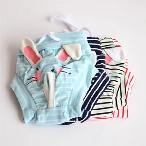 Detailed view of striped bunny-themed dog physiological pants in multiple colors