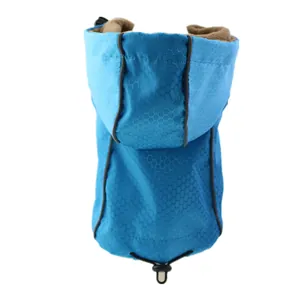 Close-up detail of blue waterproof dog jacket featuring fleece lining and reflective strips